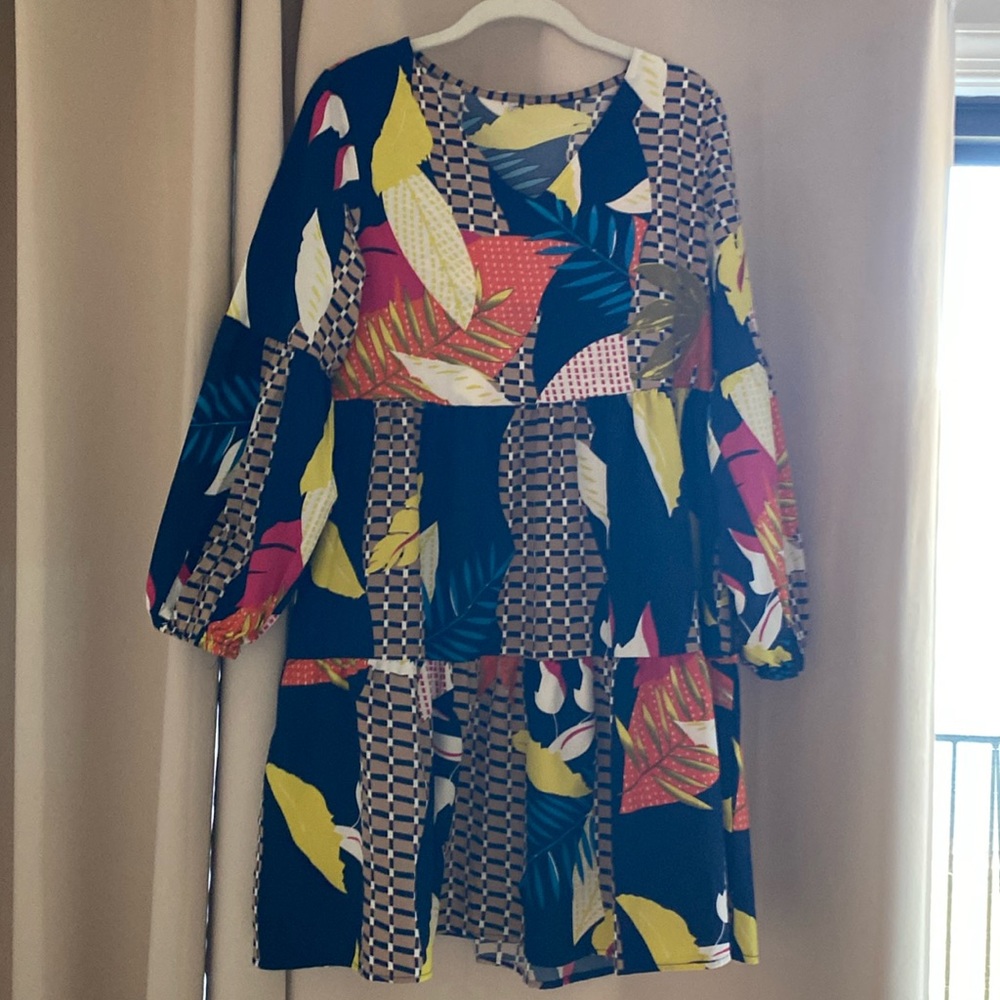 Long sleeve baby doll print dress.